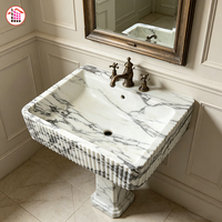 Lavabo mural cannelé en marbre Arabescato naturel, vasque intégrée en pierre pour villas de luxe et salles de bain d'hôtels