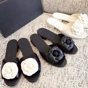 Summer New Beach Vacation One Word Open Toed Flat Bottom Outerwear Camellia <b>Slippers</b> for Women - Product Image 1