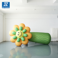 Modèle de fleur gonflable jaune personnalisé en forme de visage souriant pour la décoration extérieure de parcs, de roadshows et de marketing de marque romantique