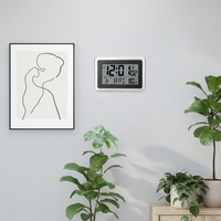 Horloge atomique numérique radiofréquence USA, silencieuse, à affichage LCD, pour bureau/mur, avec affichage de la température, de l'heure, des secondes, du jour de la semaine et 4 fuseaux horaires