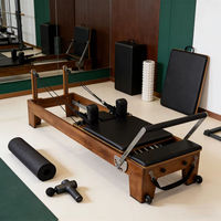 Machine de Pilates pour le remodelage corporel avec cadre en noyer, réglable, dotée de fonctions de bien-être, adaptée à un usage domestique