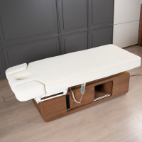 Table de massage professionnelle moderne en PU blanc laiteux avec télécommande 4 moteurs et éponge haute densité pour hôtels, salons de beauté, gymnases et écoles