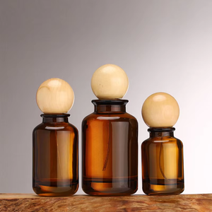 Botella de Perfume Redonda de Vidrio Ámbar de Lujo Vacía de 30 ml, 50 ml, 100 ml con Tapa de Bola de Madera - Product Image 4