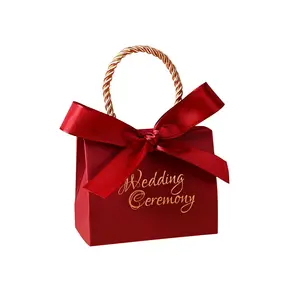 Cajas de Regalo de dulces de papel, suministros de boda personalizados creativos, bolsa de mano roja, ceremonia, regalo, caja con mango para invitados