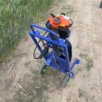 Machine de plantation d'arbres à une personne à quatre affleurements Petite pelle à trous pour gaules Poteaux de ciment Forage au sol Tarière de terre