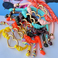 Bracelet en corde tressée réglable et coloré avec breloque cœur creux doré, bracelet d'amitié, bijou tendance, cadeau pour femmes et filles