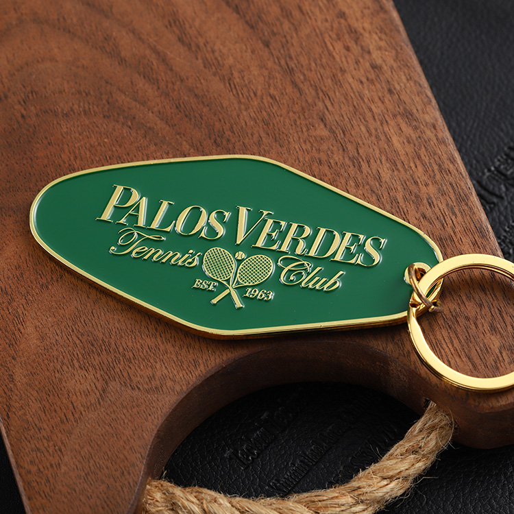 Llavero de motel chapado en oro