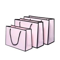 Emballage de cuisson de vêtements personnalisés haut de gamme impression de logo sac en carton blanc solide emballage de courses à la main