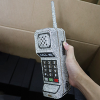 Sac de soirée de luxe en forme de téléphone pour femme, vente en gros d'usine, pochette à strass creux en cristal avec chaînes décoratives, style tendance