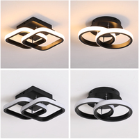 Plafonnier Led minimaliste composé d'anneaux lumineux, idéal pour un salon, une cuisine, une chambre à coucher ou une salle à manger