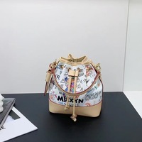 Sac seau de luxe de créateur pour femme, imprimé graffiti et dessin animé, avec cordon de serrage, sac à main, sac à bandoulière et sac porté croisé tendance