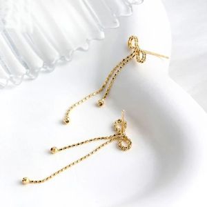 Xinfly Simple Fashion Bow Tassel Earrings 18K Gold Lace Plain AU750 Earrings for Women for Parties and Trendy Style - Product Image 2