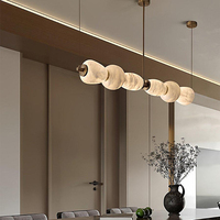 Lustre en marbre d'albâtre espagnol de luxe haut de gamme en cuivre, design moderne et minimaliste, longue bande, pour salle à manger, bar, réception