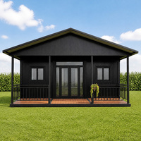 Maisonnette préfabriquée en bord de mer avec véranda, maison modulaire en acier noir pour station balnéaire