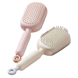 Cepillo de pelo con cojín de aire expandible y retráctil, con diseño de calavera esponjosa, anti-enredos y para masaje del cuero cabelludo, para mujer - Product Image 1