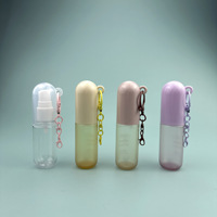 Bouteille pulvérisateur portable pour enfants de 30 ml en plastique PET à fond rond, avec crochet, givrée, sérigraphiée or/argent, estampée à chaud
