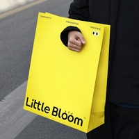 Emballage de vêtement avec logo personnalisé le plus vendu avec poignée trouée sac d'expédition personnalisé réutilisable et écologique