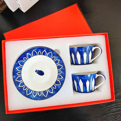 blue double cups and saucers