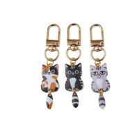 Porte-clés en alliage métallique en gros, en forme de cœur ou rond, pour femmes et filles, avec motif de chat de dessin animé mignon, idéal comme cadeau promotionnel