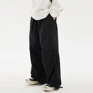 factory wholesale men wide leg nylon cargo pants custom logo adjustable leg joggers black y2k loose fit parachute pants men