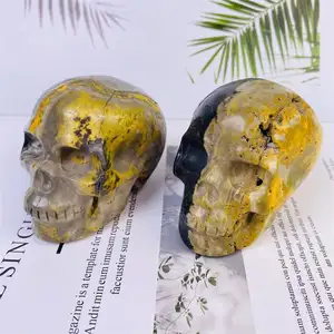 Wholesale natural high quality bumblebee jasper crystal head carvings reiki yellow crystal skulls for home decoration