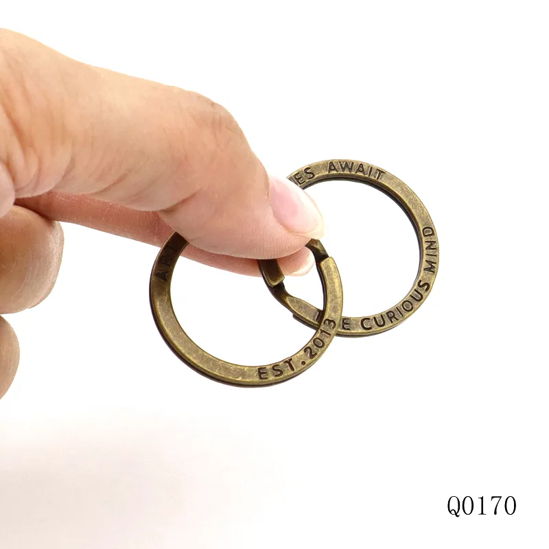 Keyring nhà sản xuất tùy chỉnh khắc logo phẳng Keyring chống braass kim loại Key Chain Nhẫn chia vòng chìa khóa