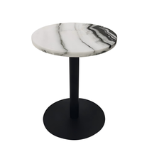 Table à manger ronde en marbre avec base en fer noir