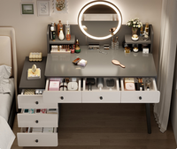 STG Coiffeuse de chambre moderne et simple gris foncé avec miroir intelligent LED et armoire de rangement télescopique monobloc pour chambre d'hôtel