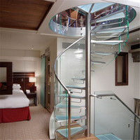 Système d'escalier en spirale élégant avec marches transparentes et rampe élégante pour maisons de luxe