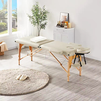 Lit de massage de salon de beauté pliable moderne de luxe, durable, à haute stabilité, avec pieds en bois