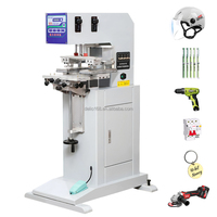 Machine d'impression tampon 2 couleurs de haute qualité avec table de travail à navette pour l'impression de logos sur stylos, balles de golf, jouets, bouteilles