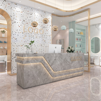 Mobilier luxueux pour salon de beauté et de coiffure en marbre blanc Bureau de réception moderne multifonction avec rangement