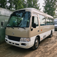 Mini-bus Toyota Coaster d'occasion 30 places, essence, importé du Japon, pour la vente aux entreprises de tourisme et de location