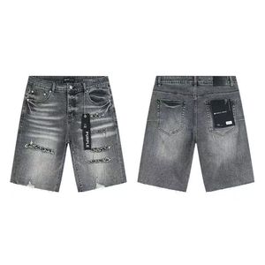 Pantalones cortos de mezclilla vintage con parches rotos, efecto salpicado de tinta y pedrería, estilo urbano de marca Purple, de corte cropped. - Product Image 1
