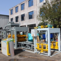 Machine à briques de pavage entièrement automatique QT4-15 pour la production de blocs de béton