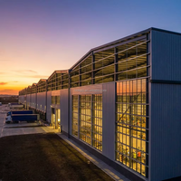 Almacén Prefabricado de Estructura de Acero Impermeable e Ignífugo con Puerta Enrollable