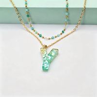 Collier à double couche avec initiale personnalisée, perles turquoise, chaîne dorée, pendentif en résine alphabet, bijoux empilables, cadeau pour couple ou meilleure amie