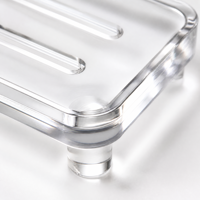 Porte-savon en acrylique personnalisé transparent avec fentes de drainage, pieds surélevés et espace pour logo, idéal pour hôtel, spa, coffret cadeau