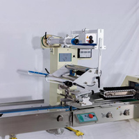 Machine d'emballage horizontale automatique 380 pour gâteaux, gaufrettes, biscuits et autres produits alimentaires, avec fonction de mise en carton et d'emballage coussin