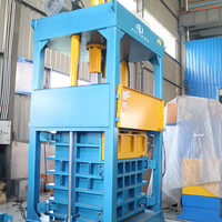 Presse à balles verticale de 60 tonnes Presse à balles textile hydraulique Presse à balles de recyclage de vêtements avec conception de chambre de levage