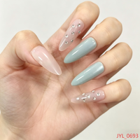Ongles longs en ABS pour femmes, style stiletto |   Manucure élégante pour femme avec dégradé rose nude et strass bleu clair