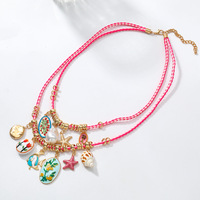 Collier double couche en cordon tressé rose avec pendentif coquillage, étoile de mer et perle peinte, style bohème, fait main pour femme