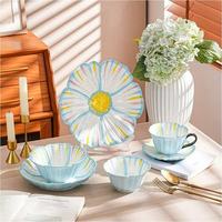 Service de table coréen en céramique à motifs floraux avec tasses et bols, orné de reliefs décoratifs, idéal pour les fêtes et les repas