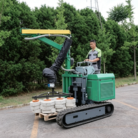 Machine de pavage automotrice sur chenilles pour dalles de béton et pierres naturelles, avec aspirateur et élévateur à palettes intégrés