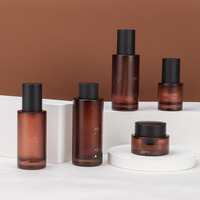Logo personnalisé luxe brun mat emballage cosmétique bouteille de lotion en verre 40ml 120ml flacon pulvérisateur de brouillard 50g visage pot en verre