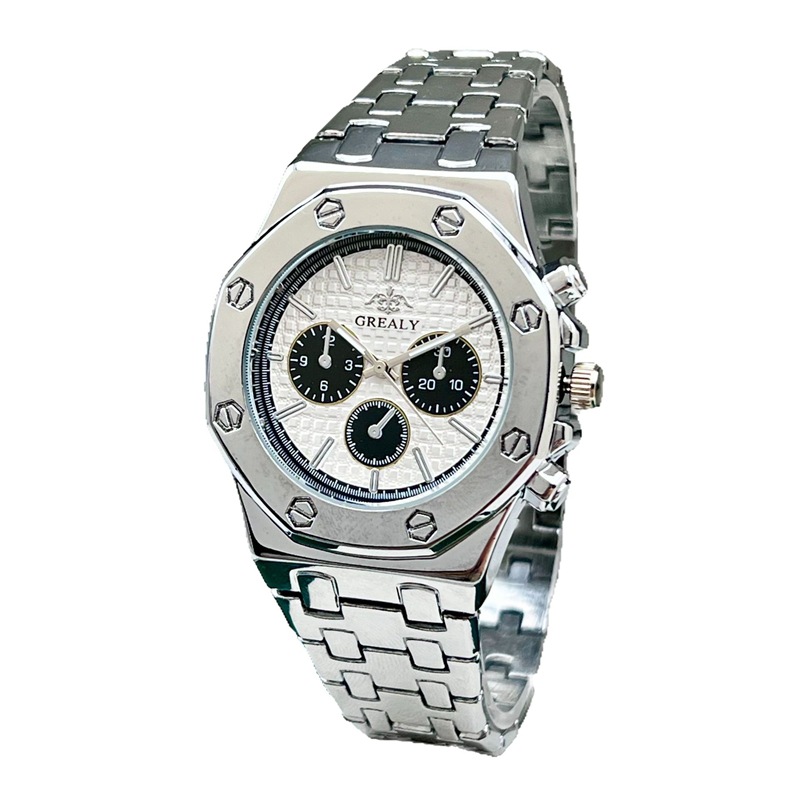 golden watch with green dial