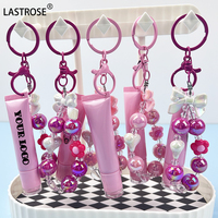 Gloss à lèvres en gros, marque privée, parfum, porte-clés, pompon, gloss à lèvres huileux, repulpeur, transparent, végan, gloss à lèvres pour enfants, porte-clés