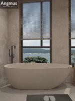 Baignoire artistique en travertin de style Wabi-Sabi, en pierre artificielle, autoportante, élégante, en forme d'œuf, pour maison, hôtel, B&B