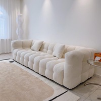 Canapé modulable sans structure en tissu bouclé, style Japandi, à segments arrondis, profil bas, personnalisable