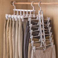 Porte-pantalons pliable en plastique multifonctionnel à plusieurs niveaux, cintre magique pour pantalons sans trace, organiseur de garde-robe domestique